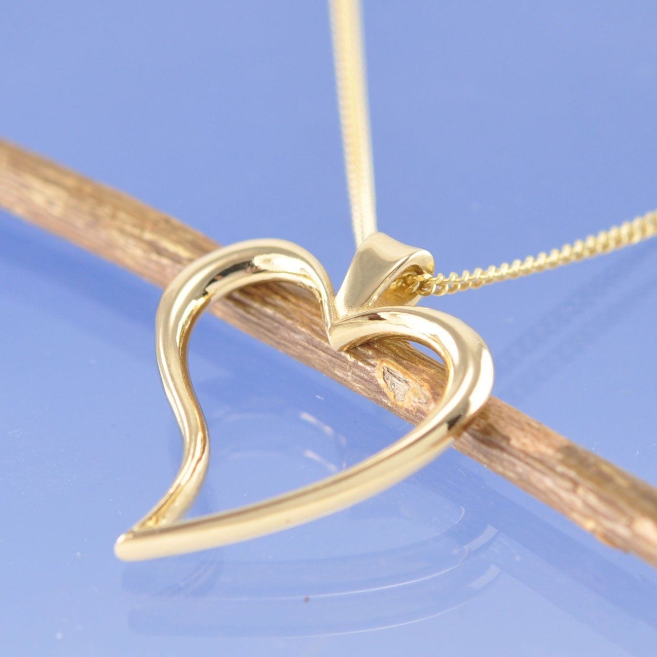 Melt your own wedding ring or rings into this heart