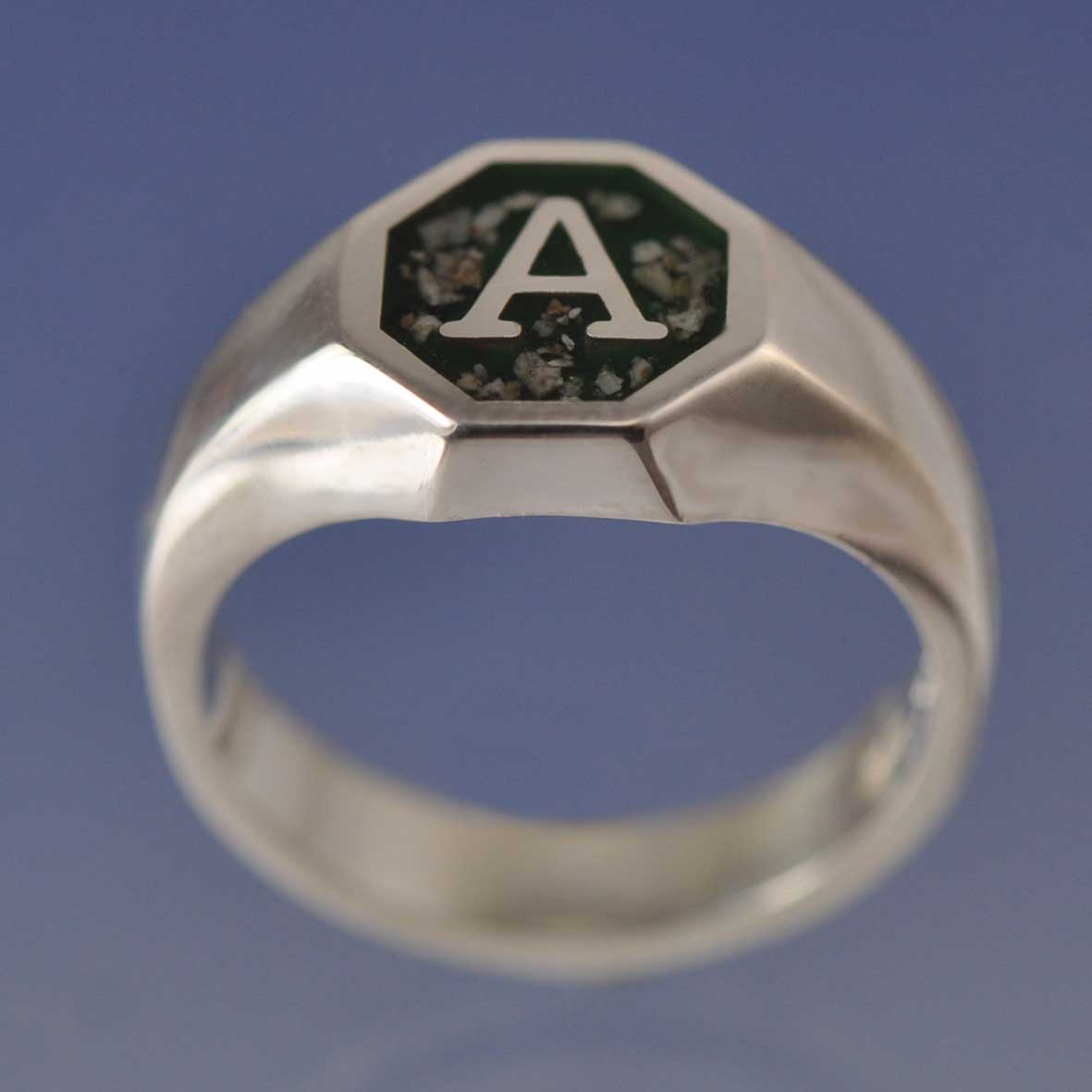 Handcrafted men's cremation ashes signet ring in recycled sterling silver, featuring a discreet memorial setting, made in the UK.