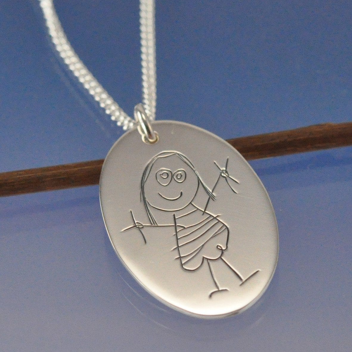 Children's drawing sale made into jewelry