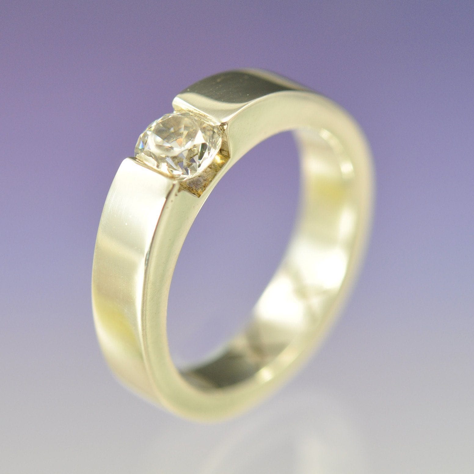 https://chris-parry-handmade.co.uk/cdn/shop/files/chris-parry-handmade-ring-faux-tension-set-diamond-ring-24050614474.jpg?v=1703098599&width=1946