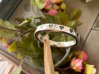 cremation ash ring video with engraved hearts in silver