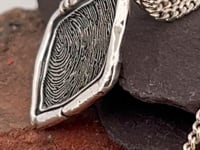fingerprint necklace, a lozenge shaped, rustic style pendant with your fingerprint engraved onto it. handmade in all the precious metals